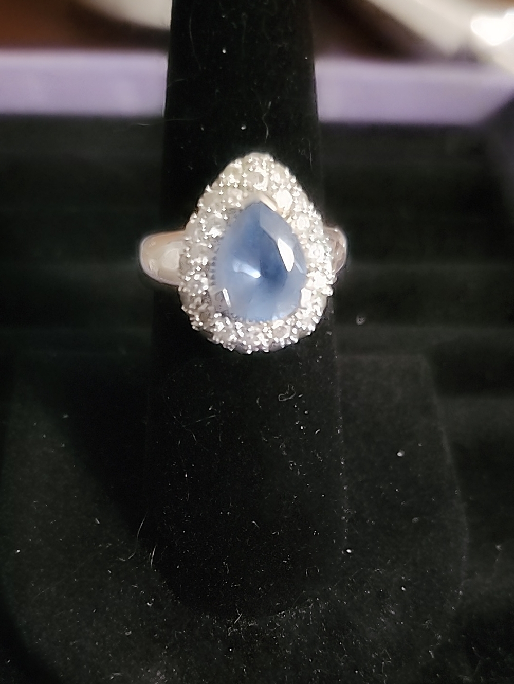 Sterling Silver Pear-Shaped Blue Halo Ring with Clear Accent Stones